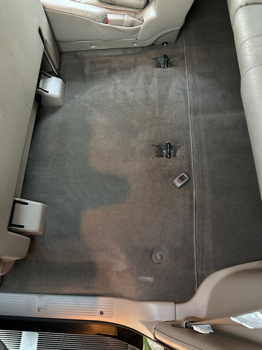This Toyota Sequoia received a three step carpet extraction process.